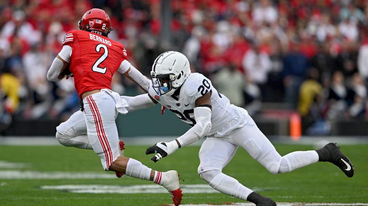 Penn State defensive end Adisa Isaac reaches for Utah’s Micah Bernard during the Rose Bowl game on Monday, Jan. 2, 2023.