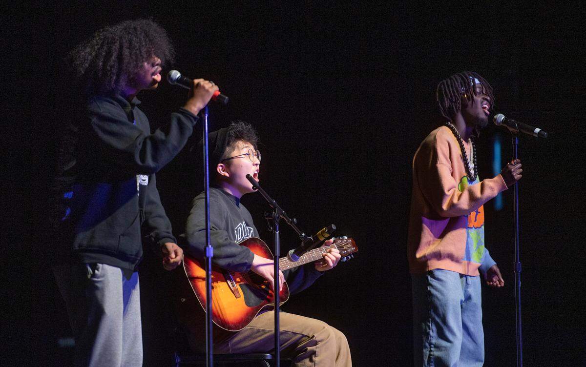 Yannick Habiyaremye, Fab Tanambelo and Youngin Ryoo perform a song during the “Lift Every Voice” cultural celebration at State College Area High School on Friday, April 8, 2022.