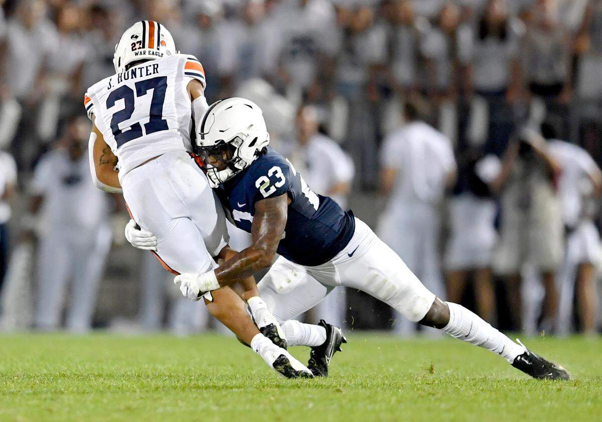 Penn State linebacker Curtis Jacobs stops Auburn running back Jarquez Hunter during the game on Saturday, Sept. 18, 2021.