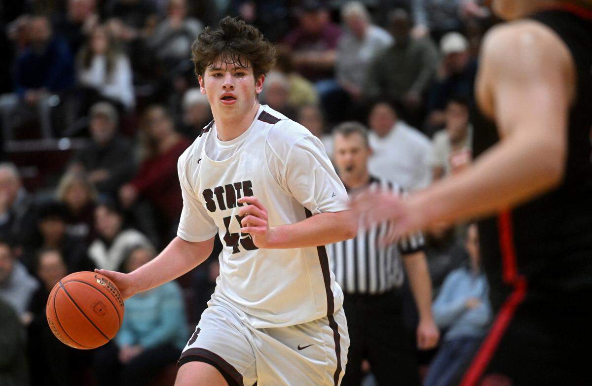 State College’s Kevin Mckenna dribbles down the court during the game against Cumberland Valley on Tuesday, Feb. 7, 2023.