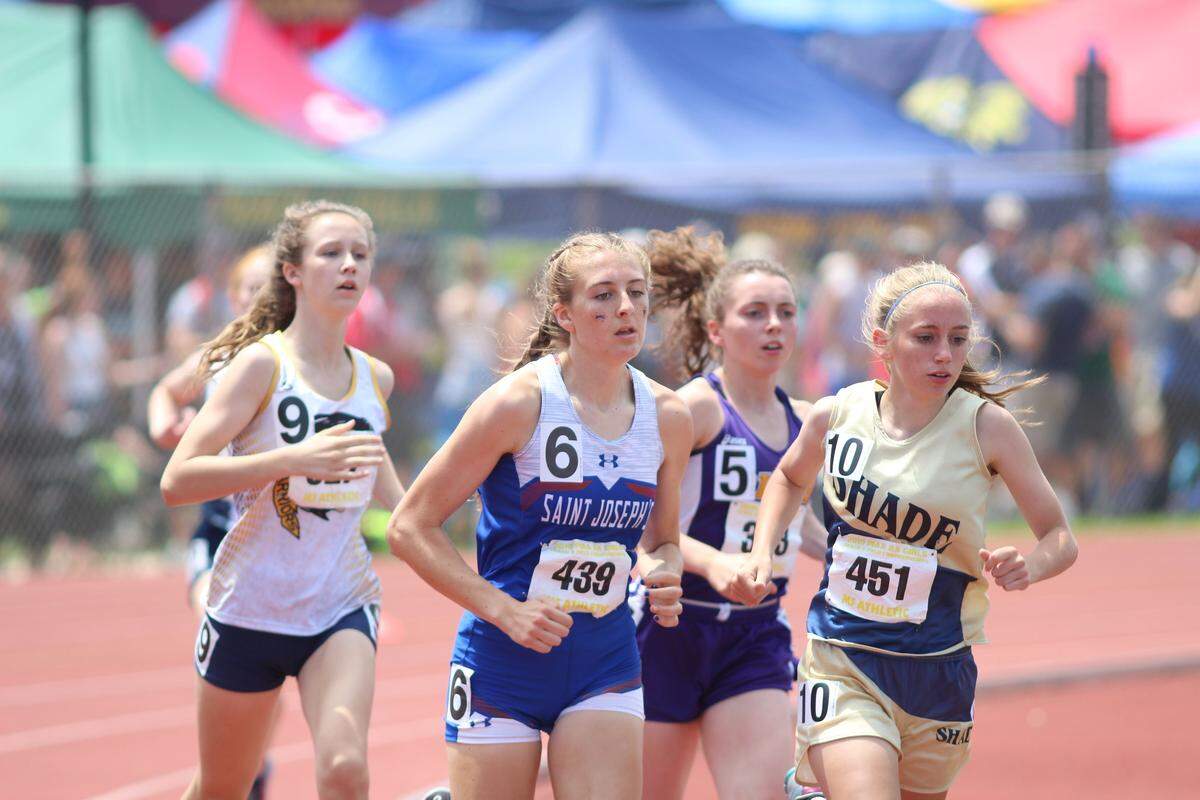 St. Joseph’s Sera Mazza, second from left, helped the Lady Wolves finish seventh as a team this spring in the PIAA Class 2A Girls’ Track and Field Championships at Shippensburg’s Seth Grove Stadium.