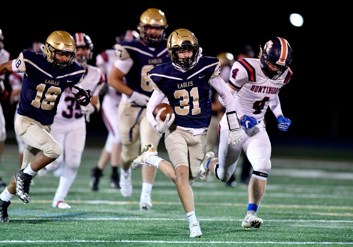 Bald Eagle AreaÕs Owen Irvin runs down the field ahead of Huntingdon defenders during the game on Friday, Sept. 18, 2020