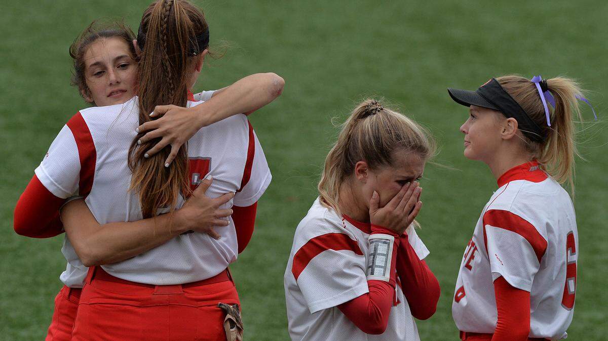 Bellefonte teammates Madison Melius, Taylor Brown, Tori Reichert and Haylie Rimmey console each other following their District 6 5A championship game loss to Central Mountain Wednesday, May 25, at St. Francis University.