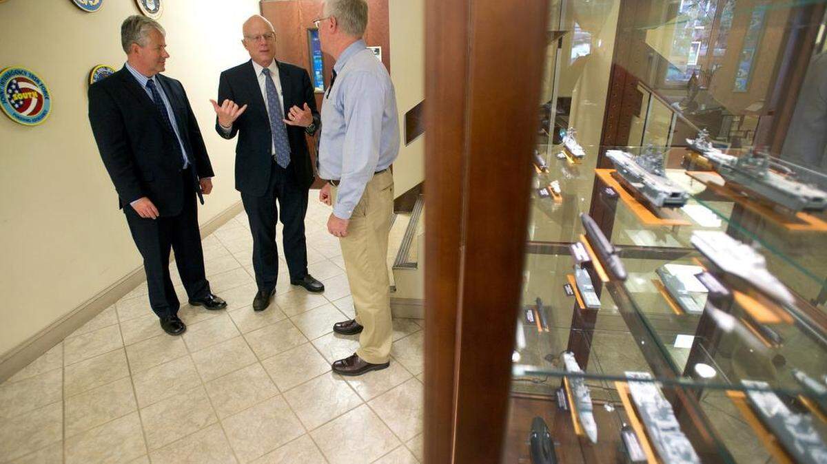 Paul Sullivan, center, director of ARL at Penn State, talks with Allen Sonsteby, left, deputy director, and Rick Marboe, acting CIO and director of engineering services, in the ARL lobby on Friday.
