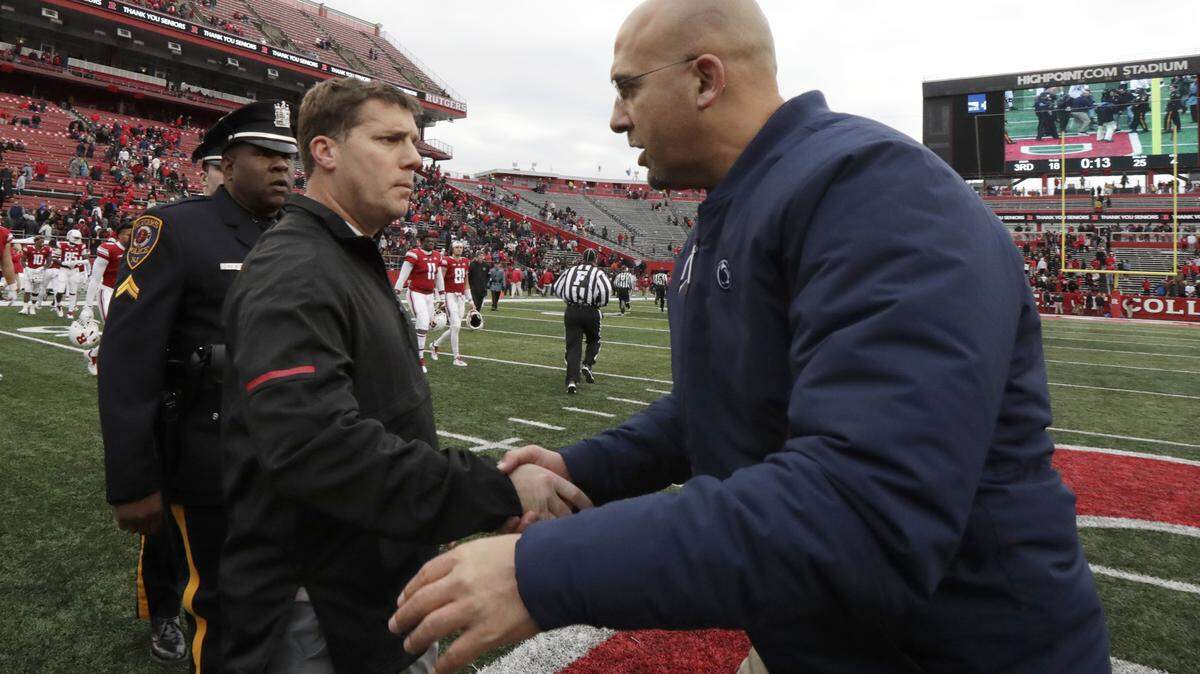 Rutgers head coach Chris Ash, left, shakes hands with Penn State head coach James Franklin after an NCAA college football game, Saturday, Nov. 17, 2018, in Piscataway, N.J. Penn State won 20-7. (AP Photo/Julio Cortez)