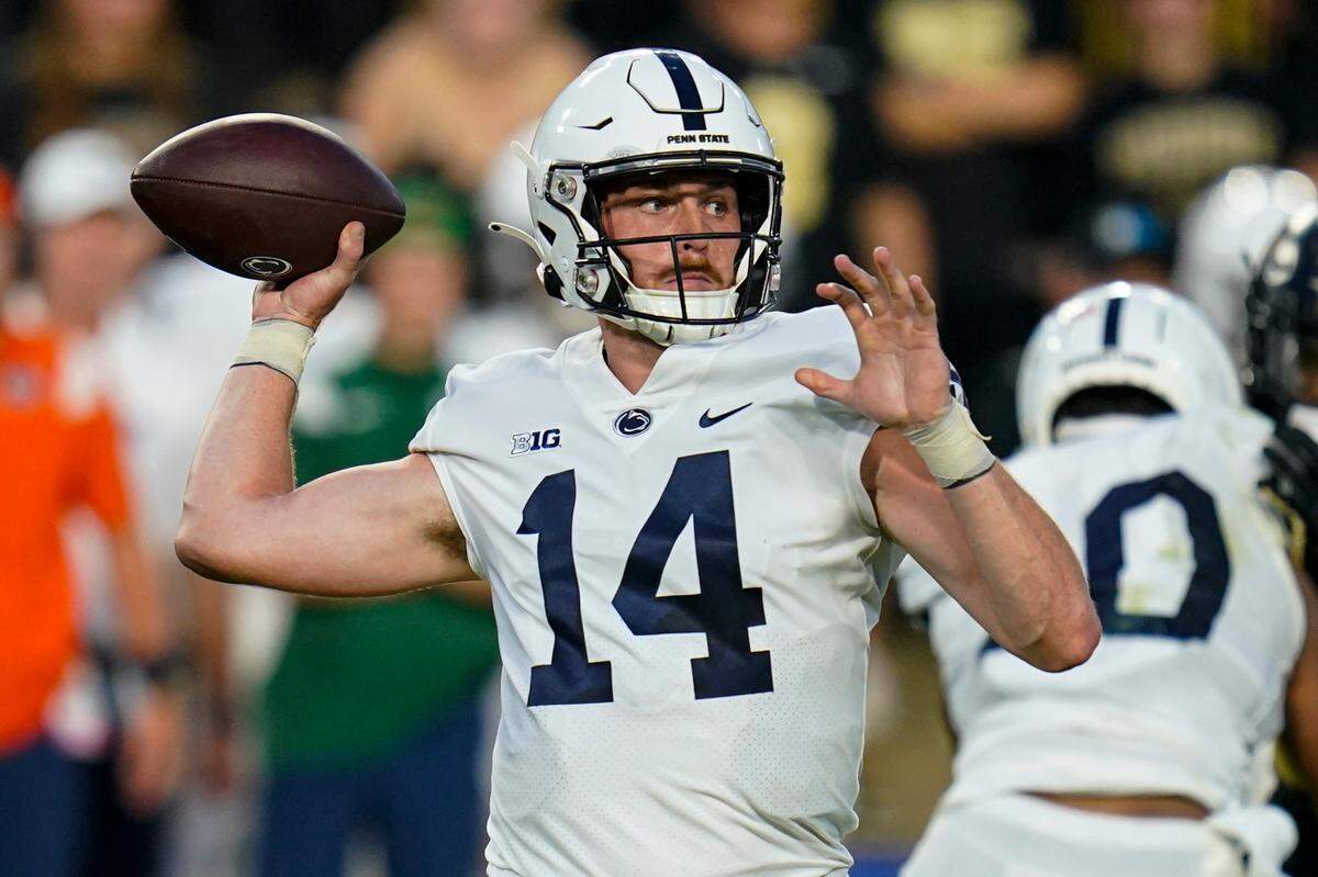 Penn State quarterback Sean Clifford (14) throws a pass against Purdue during the first half of an NCAA college football game in West Lafayette, Ind., Thursday, Sept. 1, 2022. (AP Photo/Michael Conroy)