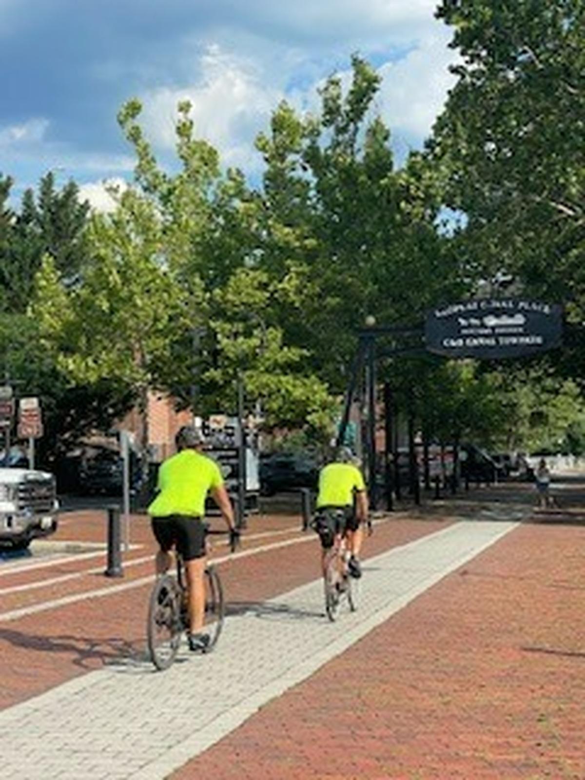 Marc Warren and son-in-law Forrest Rothrock, who joined for the last 23 miles, nearing the end of the Greater Allegheny Passage Trail in Cumberland, Maryland during Warren’s 2023 ride.