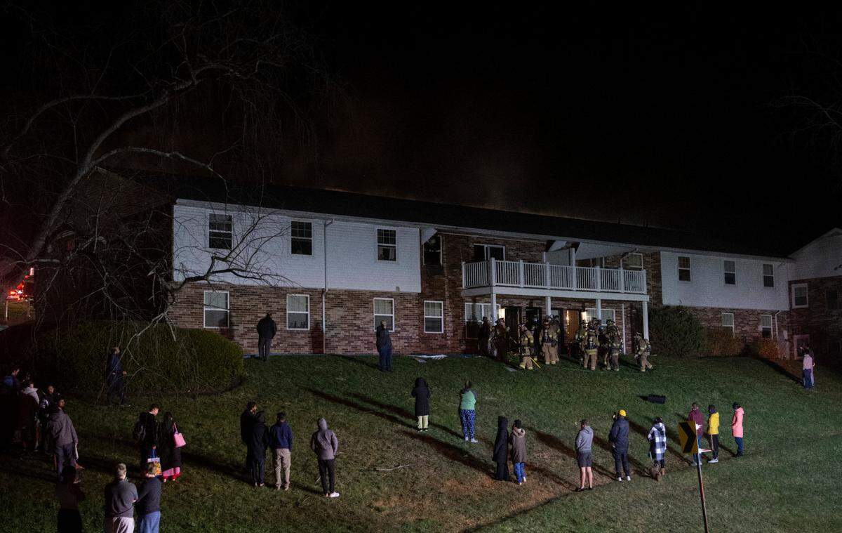 Firefighters work at the scene of an apartment fire at Vairo Village in Patton Township on Sunday, April 2, 2023.