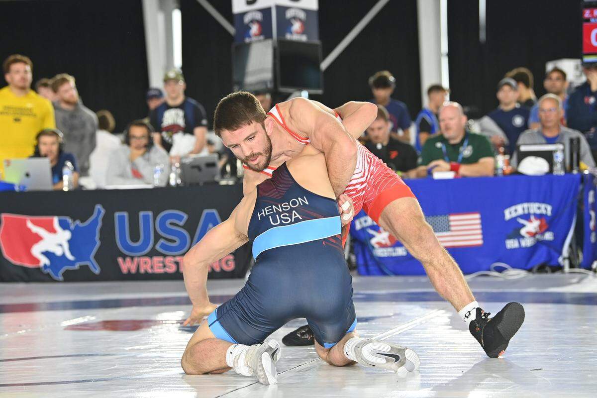 Former Penn State wrestler Zain Retherford fights off a shot attempt from Virginia Tech’s Caleb Henson during their 70-kilogram finals of the US World Team Trials in Louisville, Ky. on Friday, May 15, 2026.