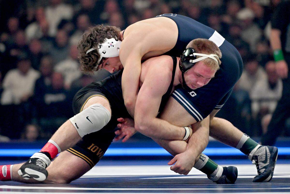 Penn State’s Levi Haines wrestles Iowa’s Patrick Kennedy in the 174-pound bout of the match on Friday, Jan. 31, 2025 at the Bryce Jordan Center. Haines won by decision 10-3.