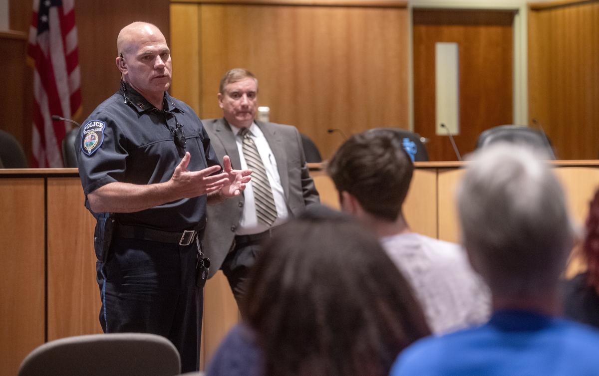 Captain Chris Fishel answers a question about accreditation during a community meeting on the results of the internal investigation in the shooting of Osaze Osagie on Aug. 20, 2019.