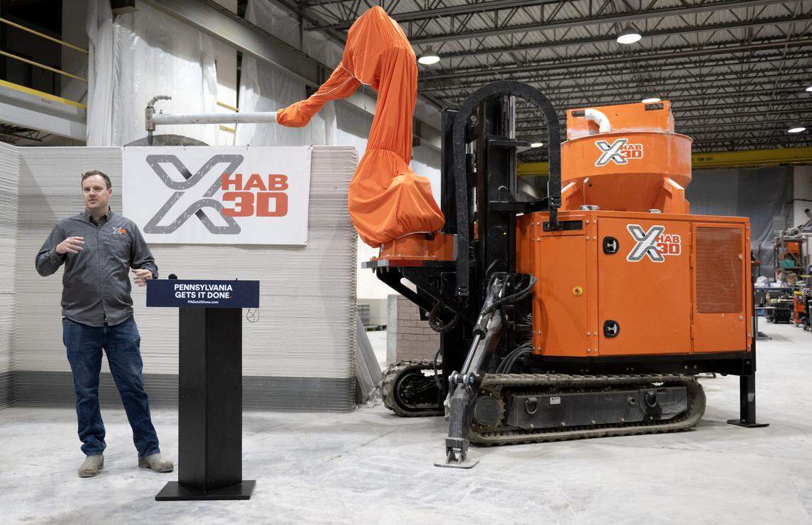 An X-Hab 3D Concrete Printing employee explains the Mobile Expeditionary 3D Printer (MX3DP) on Thursday, March 5, 2026. 