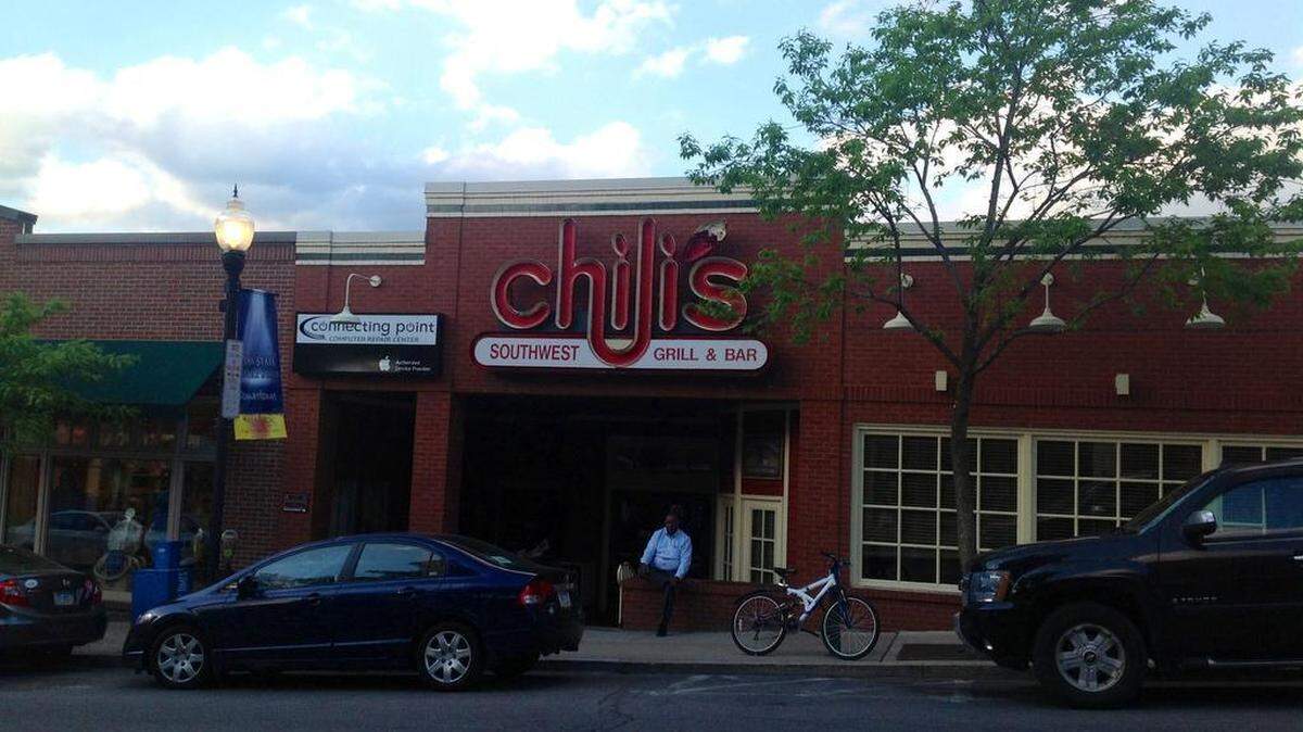 Juan Anderson, of Pittsfield, Mass., sits outside Chili’s in downtown State College where he was set to meet clients for a business meeting Tuesday. 
