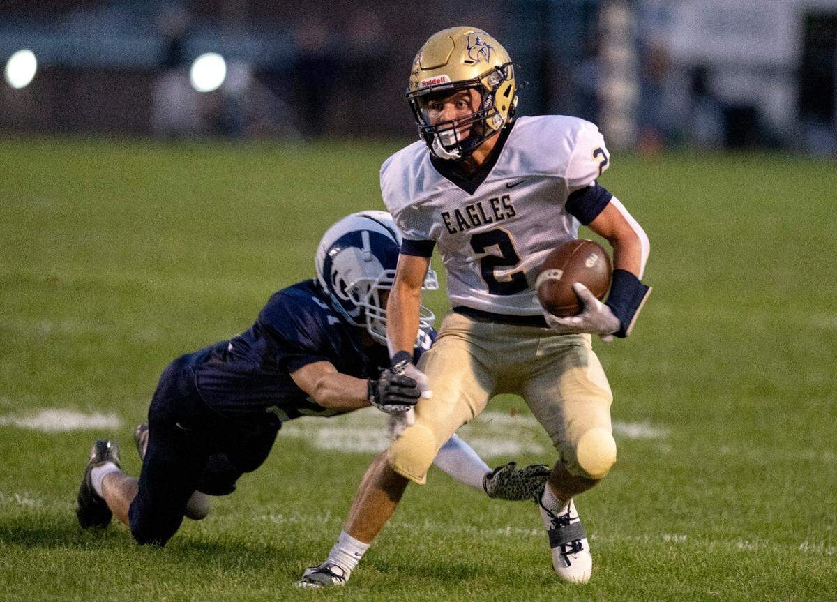Bald Eagle Area’s Kahale Burns cuts down the field with the ball from a Penns Valley defender during the game on Friday, Sept. 8, 2023.