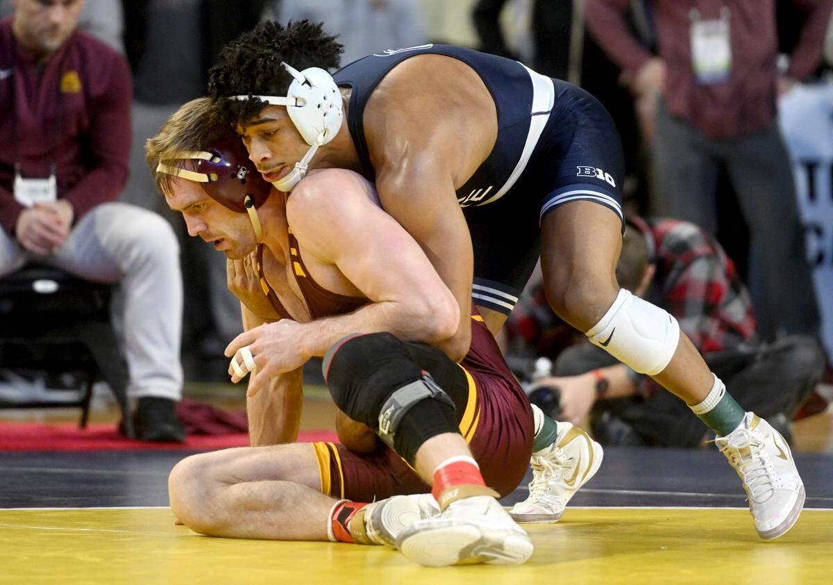 Penn State’s Carter Starocci wrestles Minnesota’s Bailee O’Reilly in a 174 lb semifinal bout of the Big Ten wrestling championships at the Crisler Center on Saturday, March 4, 2023.