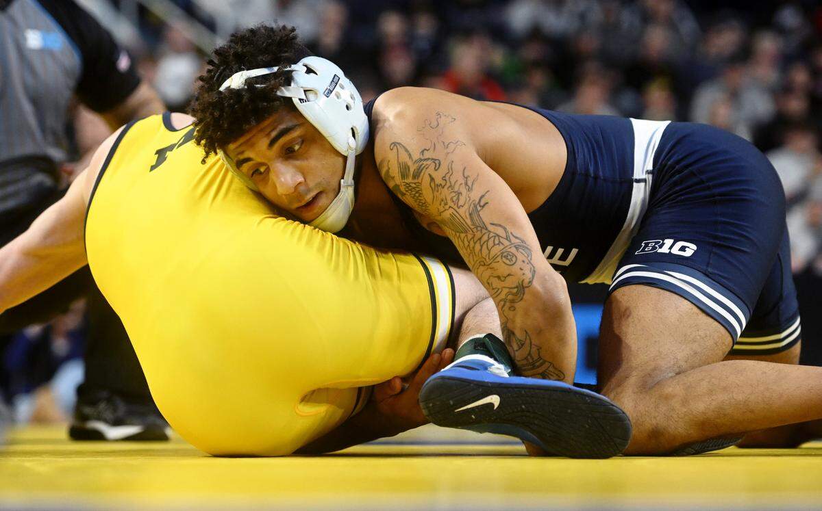 Penn State’s Roman Bravo-Young controls Michigan’s Dylan Ragusin in a 133 lb semifinal bout of the Big Ten wrestling championships at the Crisler Center on Saturday, March 4, 2023.