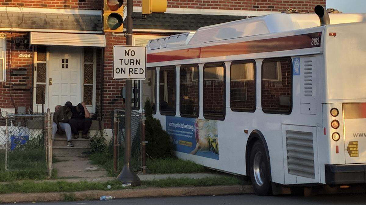 In this Thursday, July 5, 2018 photo, a Southeastern Pennsylvania Transportation Authority (SEPTA) bus rests on the front yard of a house after crashing in Philadelphia. The crash killed James Derbyshire, 52, and injured several others, including the 49-year-old bus driver.