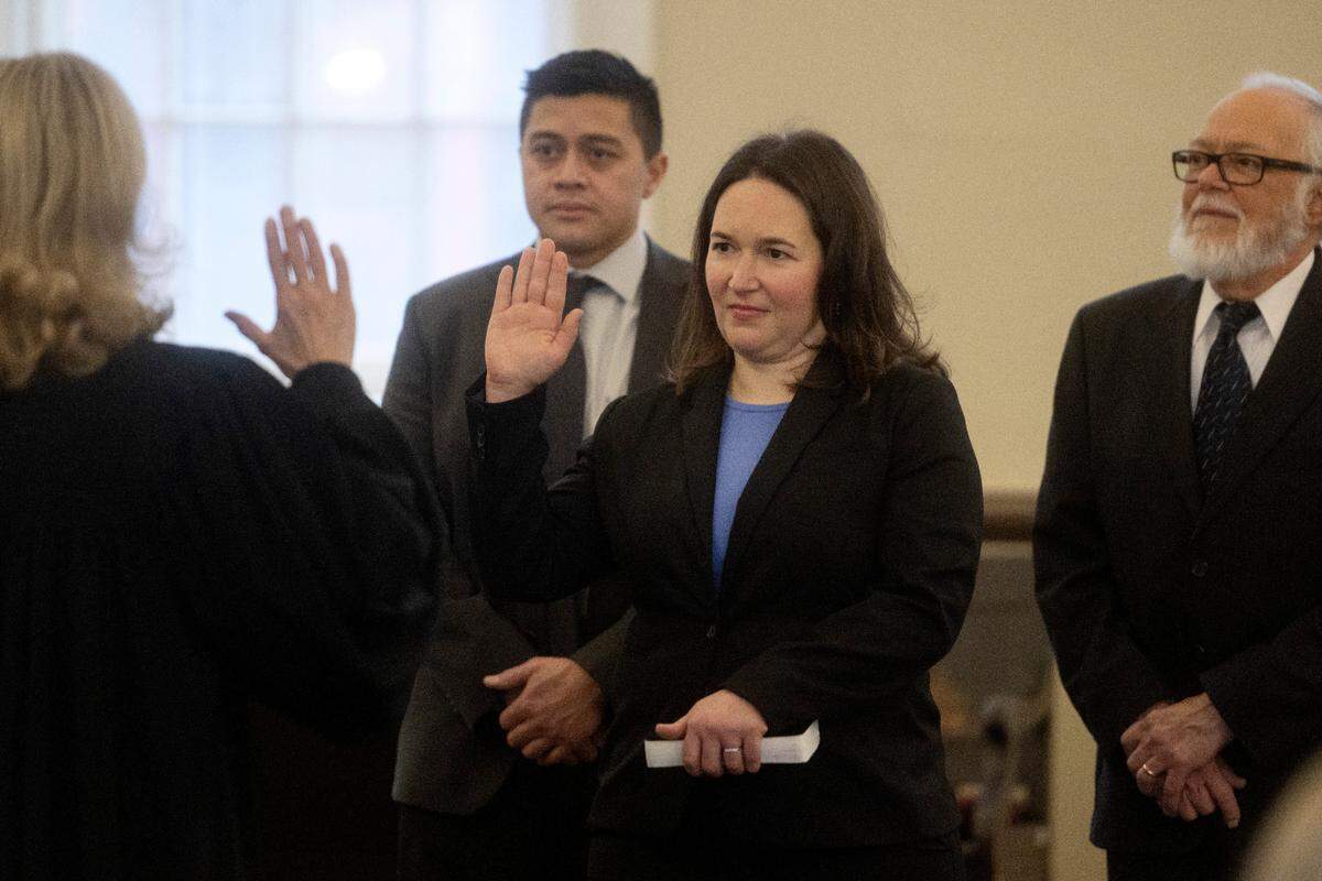 Senior Judge Pamela A. Ruest swears in Amber Concepcion Tuesday as a new Centre County Commissioner.