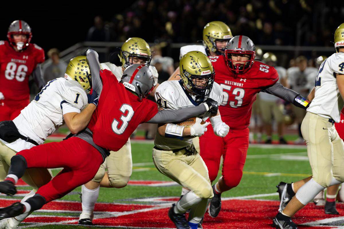 Bald Eagle Area senior Nick McCulley (41) runs through defenders during a Friday night football game against Westmont Hilltop in Johnstown, Pa., on Oct. 10, 2025. The Eagles beat the Warriors 28-0.