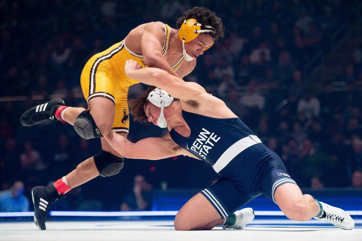 At 157, Tyler Kasak, right, wrestles Jared Hill, left, during the dual meet between Penn State and Wyoming on Sunday, Dec. 15, 2024.