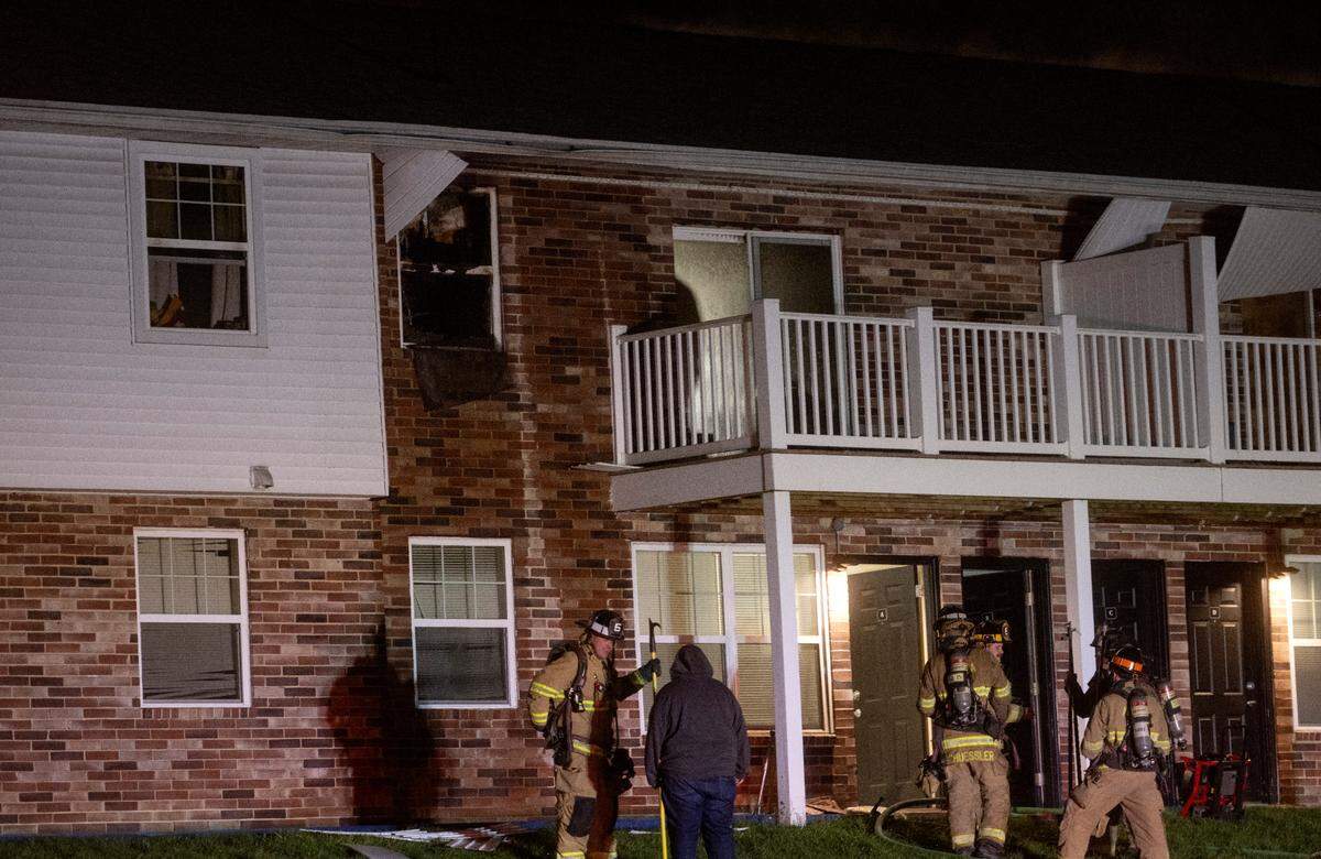 Firefighters work at the scene of an apartment fire at Vairo Village in Patton Township on Sunday, April 2, 2023.