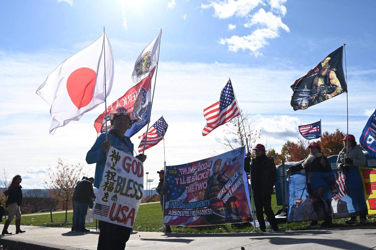 Members of the Rod of Iron Ministry gather outside the Bryce Jordan Center during a Trump rally on Saturday, Oct. 26, 2024.
