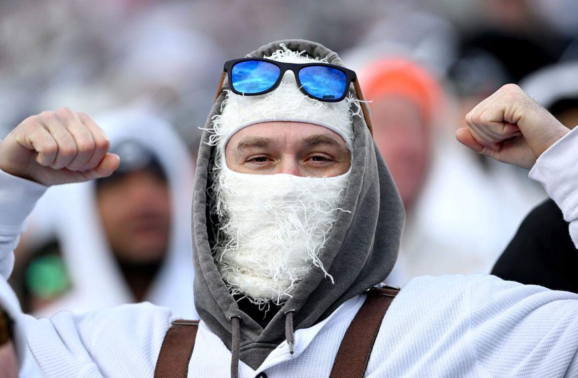 A fan flexes in the stands during the Penn State game against SMU in the first round of the College Football Playoff on Saturday, Dec. 21, 2024 at Beaver Stadium.
