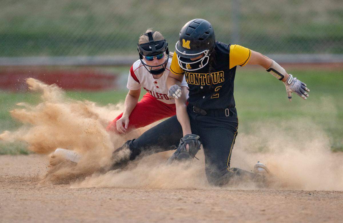 Bellefonte’s Kierra Narehood tags out Montour’s Gia LaBrie during the first round game of the PIAA class 4A softball playoffs on Monday, June 5, 2023.