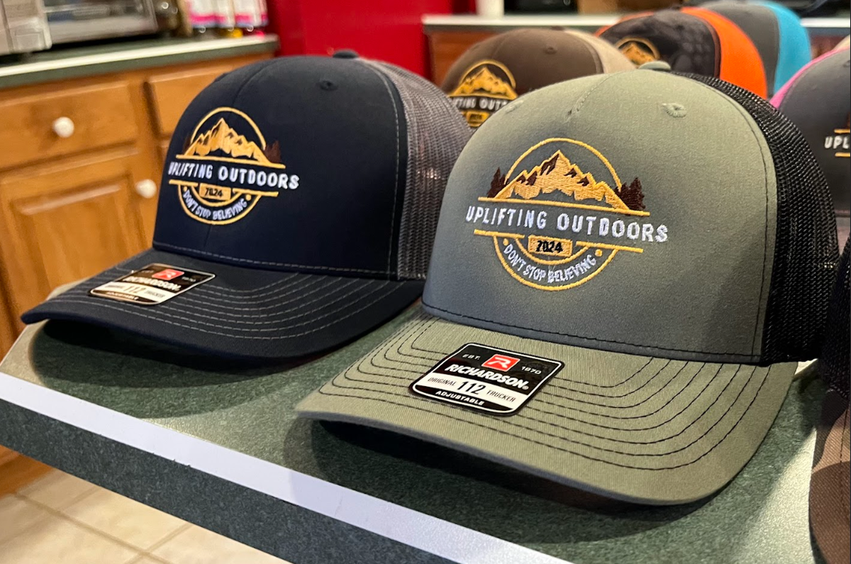 Several Uplifting Outdoors hats, available in a variety of colors.