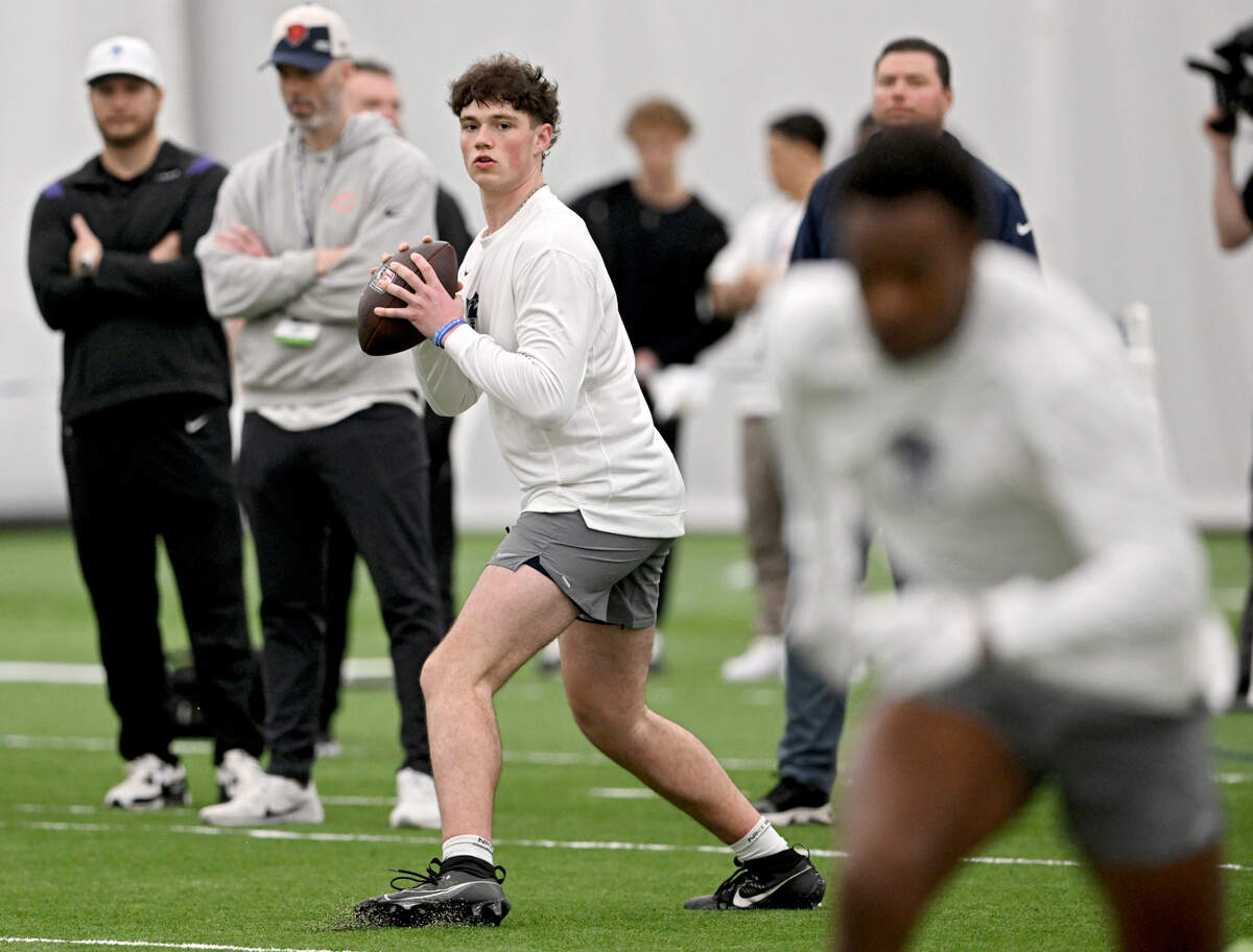 Penn State quarterback Drew Allar drops back to make a pass during Penn State’s Pro Day on Friday, March 15, 2024 in Holuba Hall.