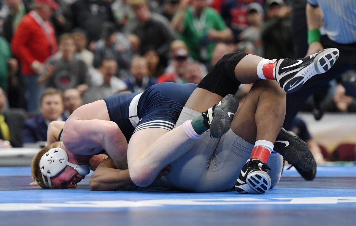 Penn State’s Bo Nickal pins Ohio State’s Myles Martin in the 184-pound finals during the NCAA Division I Wrestling Championships Saturday, March, 17, 2018 at the Quicken Loans Arena in Cleveland, Ohio.