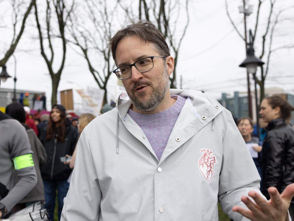 Brant Rosenberger, a State College resident, explains why he attended Saturday’s “Hands Off!” rally at State College’s Sidney Friedman Park, in opposition of President Donald Trump. The event was part of a nationwide effort that saw more than 1,000 similar rallies held across all 50 states.