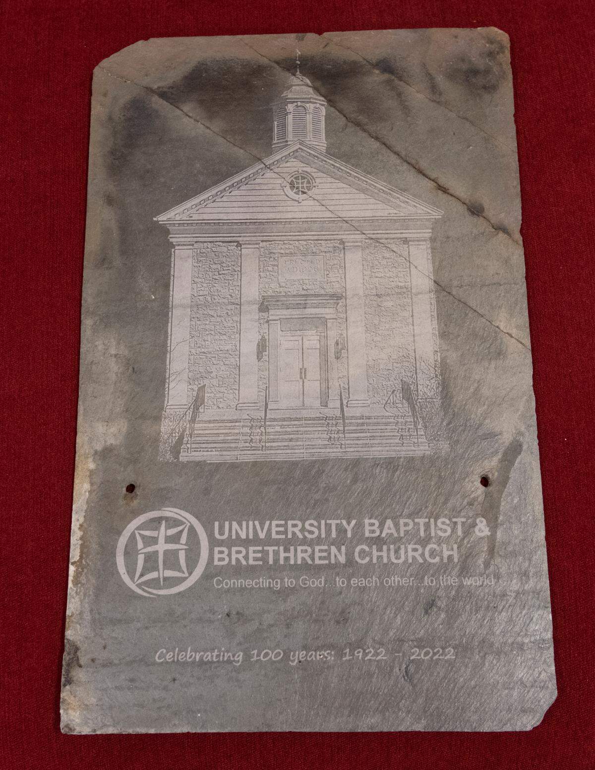 Original roof tiles with an image of University Baptist & Brethren Church on them are being sold as part of the 100 year celebration.