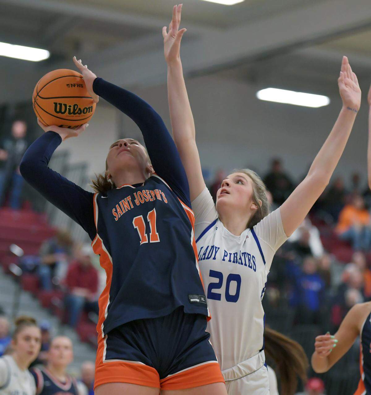 St. Joseph Academy's Aubrey Yartz scores on Williamsburg's Levada Gorsuch during the PIAA Class A semifinal game Tuesday, March 17, 2026 in Altoona. 