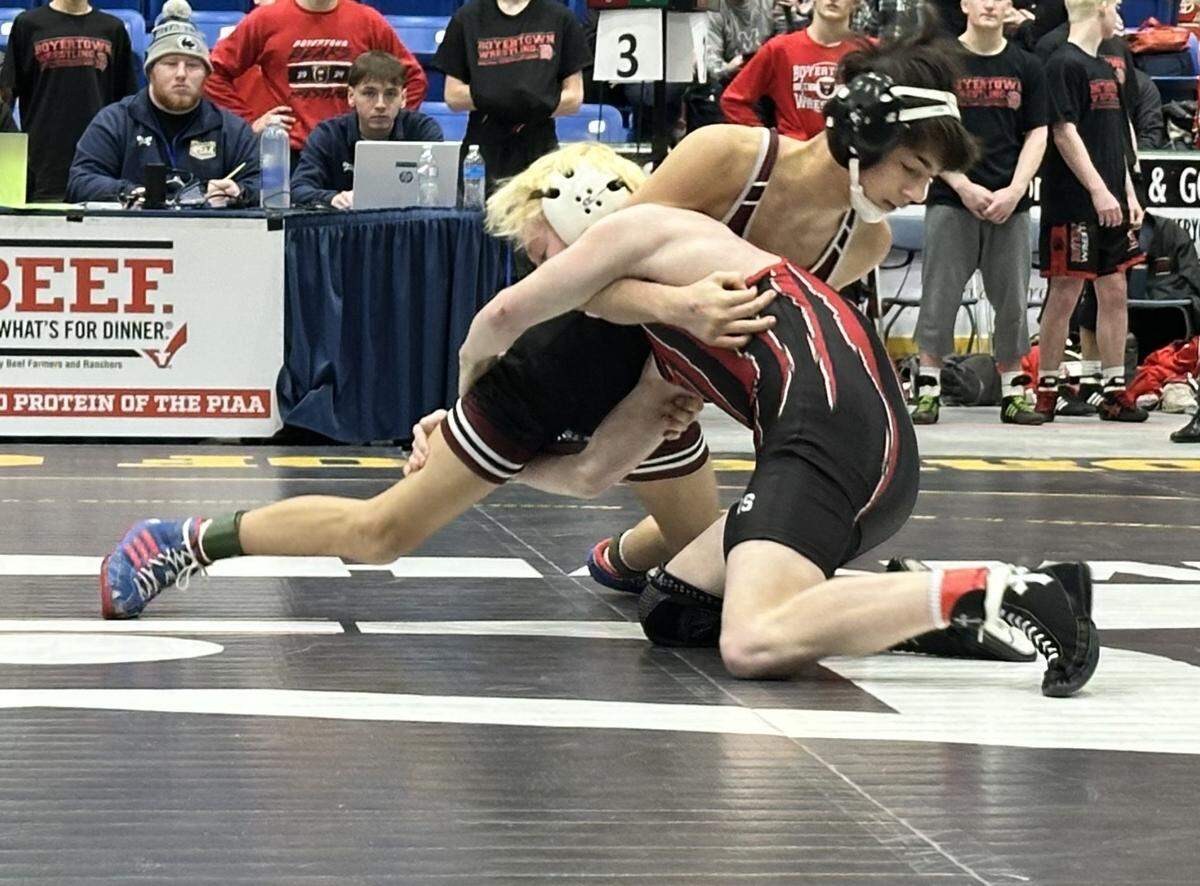 State College’s Camden Fletcher fights off a shot attempt from Boyertown’s Jacob Stanchak in their 107-pound bout on Saturday, Feb. 7, 2026 in 1st Summit Arena in Johnstown at the consolation quarterfinals of the PIAA Class 3A Team Wrestling Championships. Stanchak topped Fletcher, 9-5, but the Little Lions lost overall 29-27.