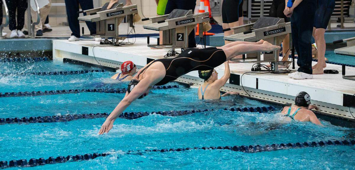 State College's Molly Workman dives into the pool in her final high school race as the anchor of the 400 freestyle relay during the PIAA Class 3A Swimming & Diving Championships at Kinney Natatorium in Lewisburg, Pa., Thursday, March 12, 2026. State College won with a time of 3:24.98.