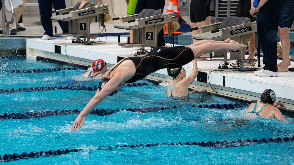 State College's Molly Workman dives into the pool in her final high school race as the anchor of the 400 freestyle relay during the PIAA Class 3A Swimming & Diving Championships at Kinney Natatorium in Lewisburg, Pa., Thursday, March 12, 2026. State College won with a time of 3:24.98.