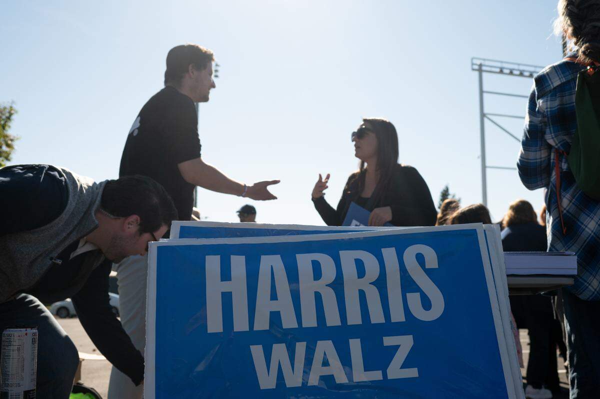 Attendees gather on Porter Road during the Blue Wall Bus Tour on Sunday, Oct. 20, 2024.