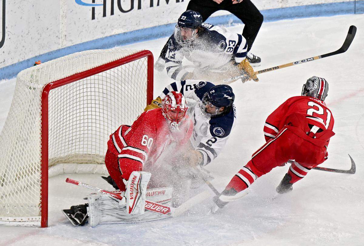 Penn State's Carter Schade collides with Ohio State goalie Kristoffer Eberly during the first period of the game on Friday, Feb. 20, 2026.  