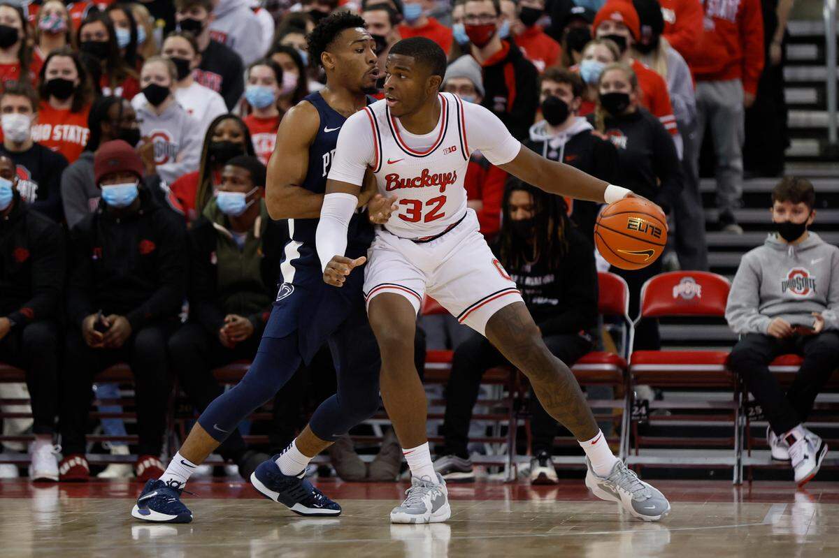 Ohio State’s E.J. Liddell, right, posts up against Penn State’s Jalen Pickett during the first half of an NCAA college basketball game Sunday, Jan. 16, 2022, in Columbus, Ohio.