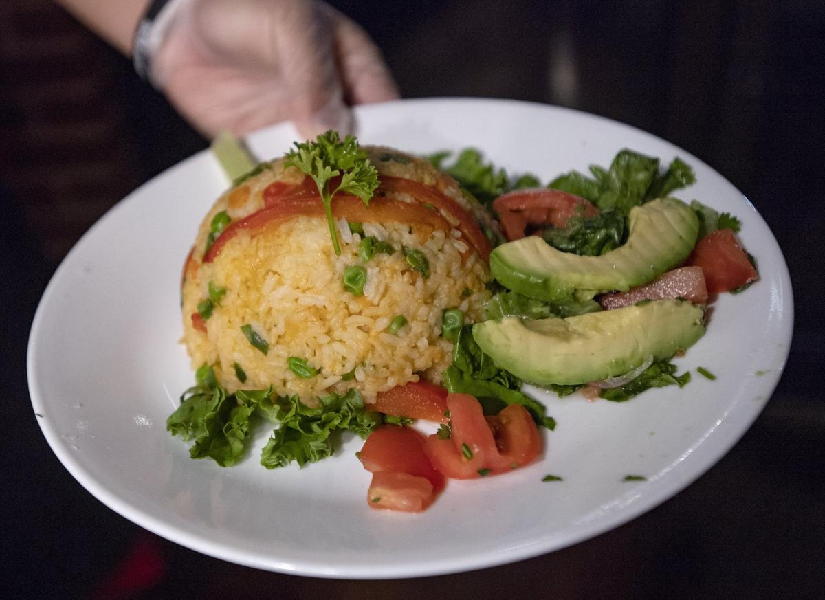 Arroz con pollo is among menu items at El Gloton, a new dining experience that opens on Friday and Saturday nights in the Bagel Crust Cafe on Westerly Parkway in State College.