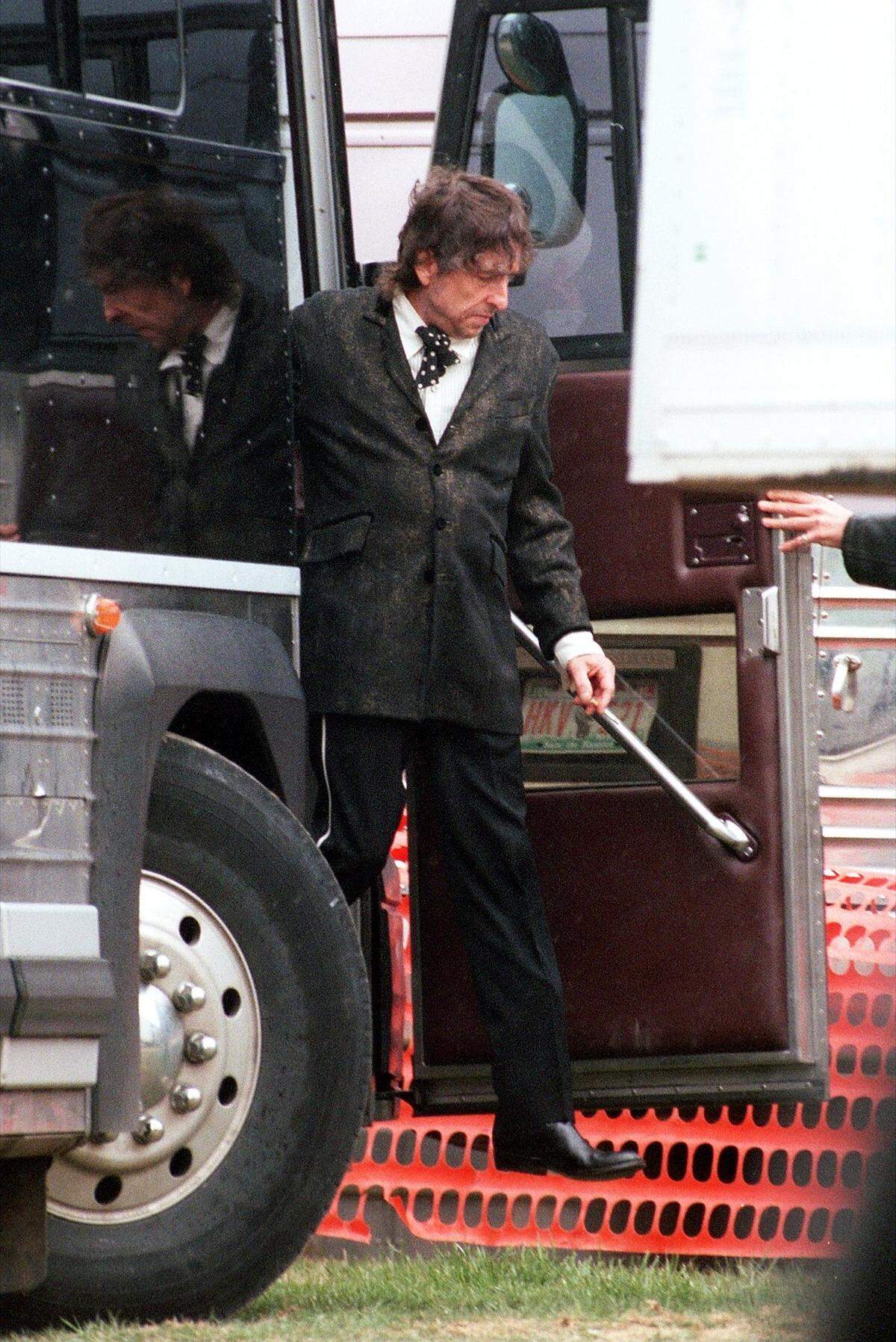 Legendary musician Bob Dylan steps off his tour bus “backstage” at the Tussey Mountain Amphitheater on April 27, 1997. After playing through the rain, he performed a three-song encore that concluded with “Rainy Day Women #12 & 35.”