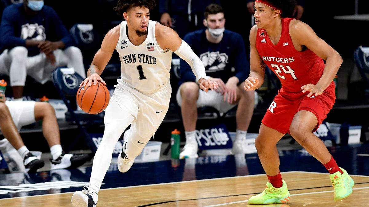 Penn State’s Seth Lundy dribbles around Rutger’s Ron Harper Jr. during the game on Thursday at the Bryce Jordan Center.