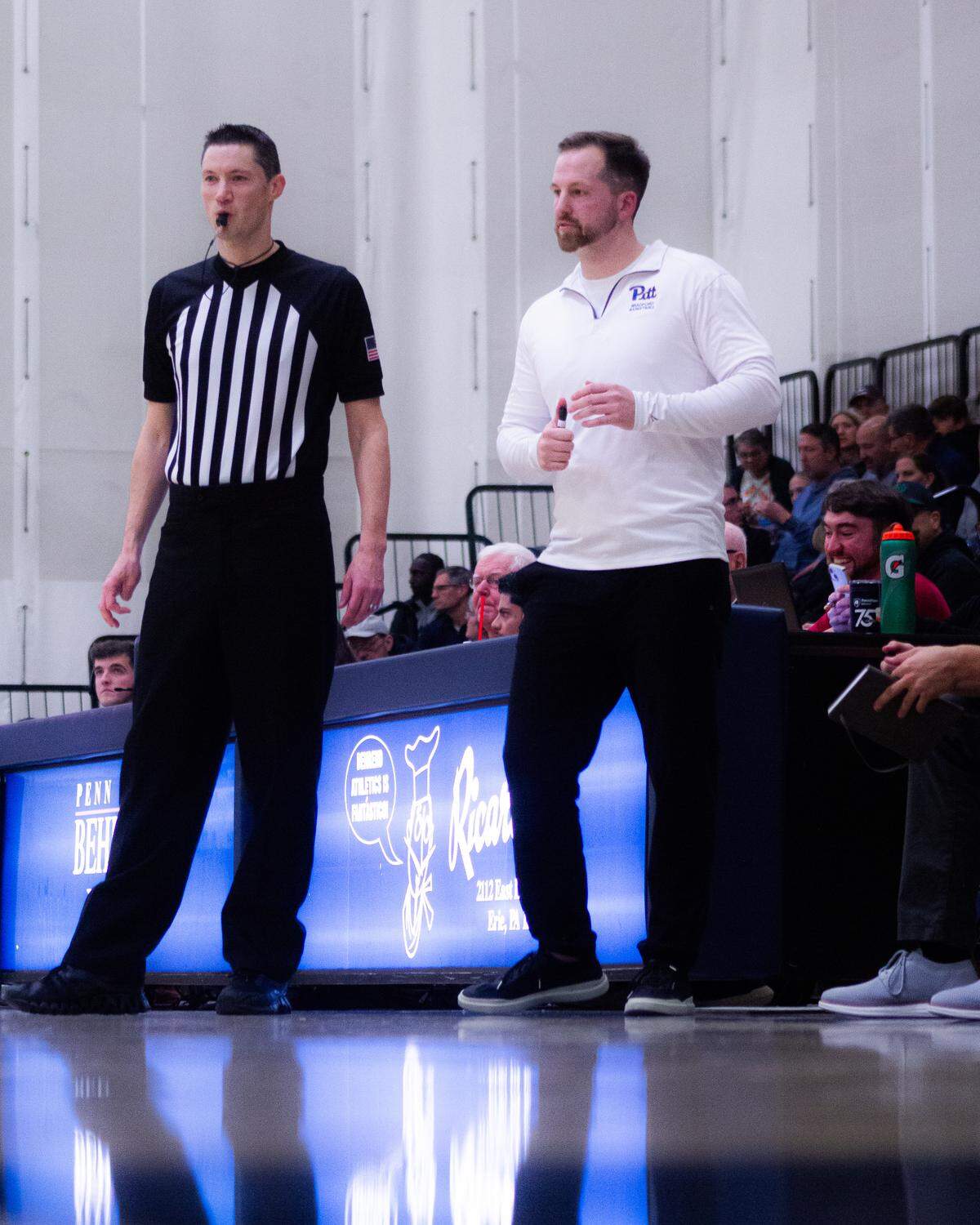 Pitt-Bradford head coach Jesse Deloof stands near referee during the game