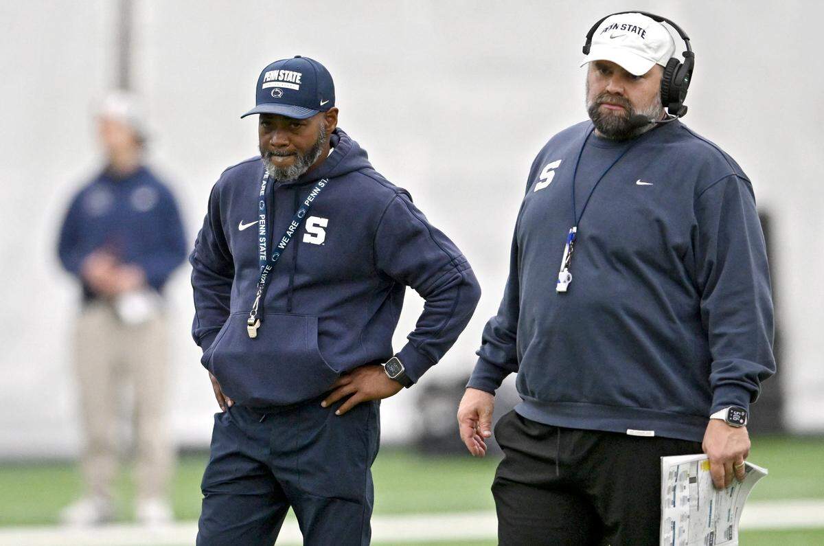 Penn State interim coach Terry Smith stands next to offensive coordinator Andy Kotelnicki as the offense runs plays during practice on Wednesday, Oct. 29, 2025. 