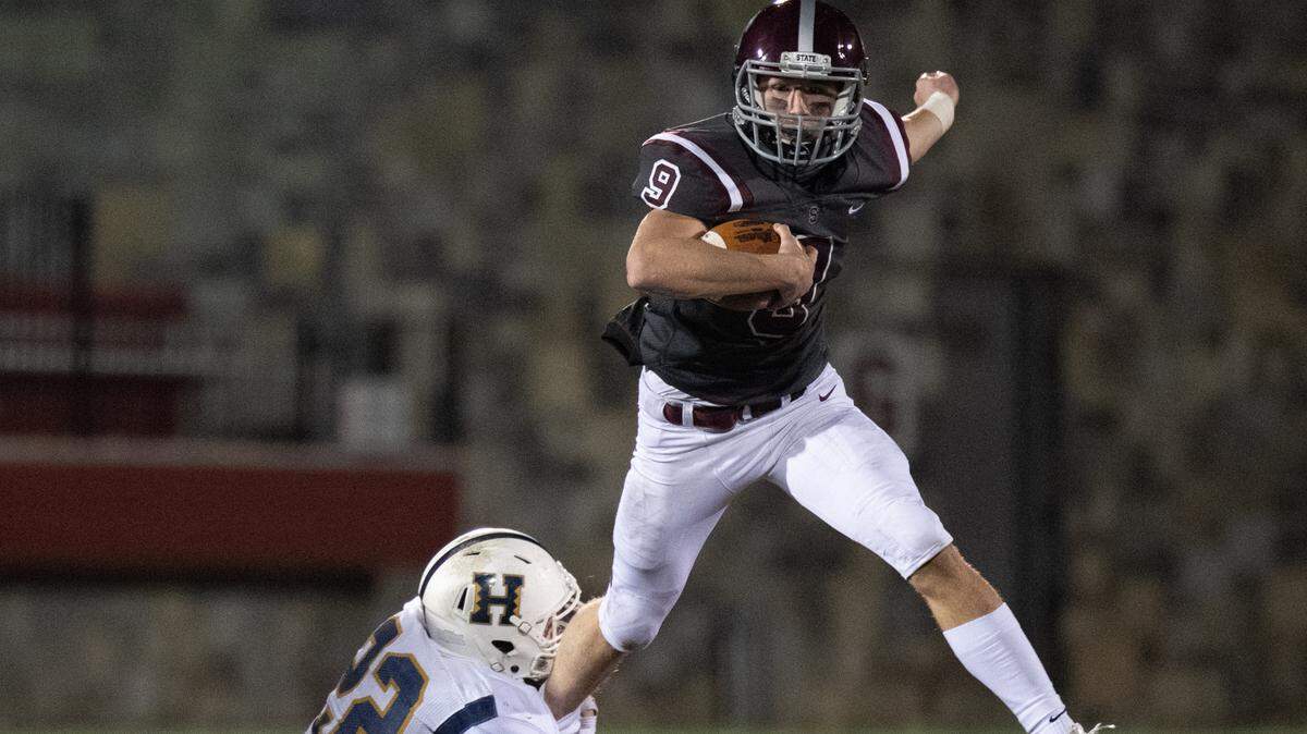 State College’s Conrad Moore runs the ball during State College’s game against Hollidaysburg at Memorial Field on Friday, Nov. 13, 2020 in State College, Pa.