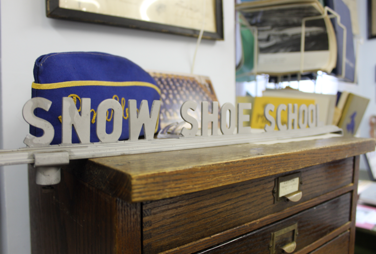 A historic “Snow Shoe School” sign on display at the David House Heritage Museum.