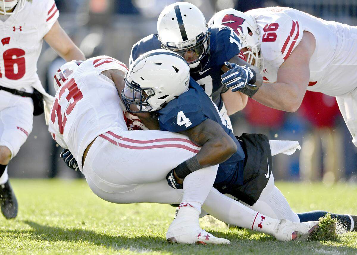 Penn State safety Nick Scott tackles Wisconsin ball carrier Jonathan Taylor during the game on Saturday, Nov. 10, 2018.