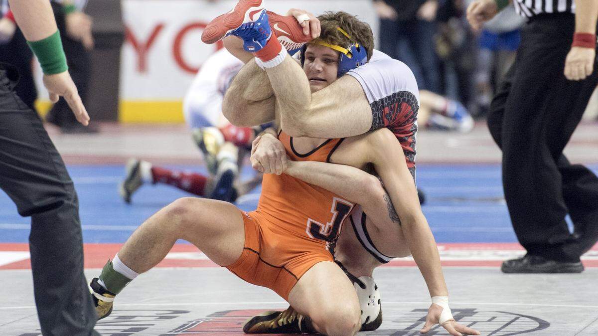 Gavin Teasdale, orange singlet, announced on his Twitter page on Tuesday that he was leaving Penn State for the fall semester for health issues. He did say that he was going to return in January.
