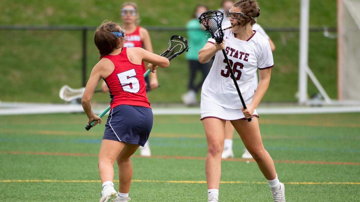 State College’s Lizzie Paterno battles for the ball during a high school lacrosse game where State College High School faced Red Land High School on, April, 29, 2021 in State College, Pa.